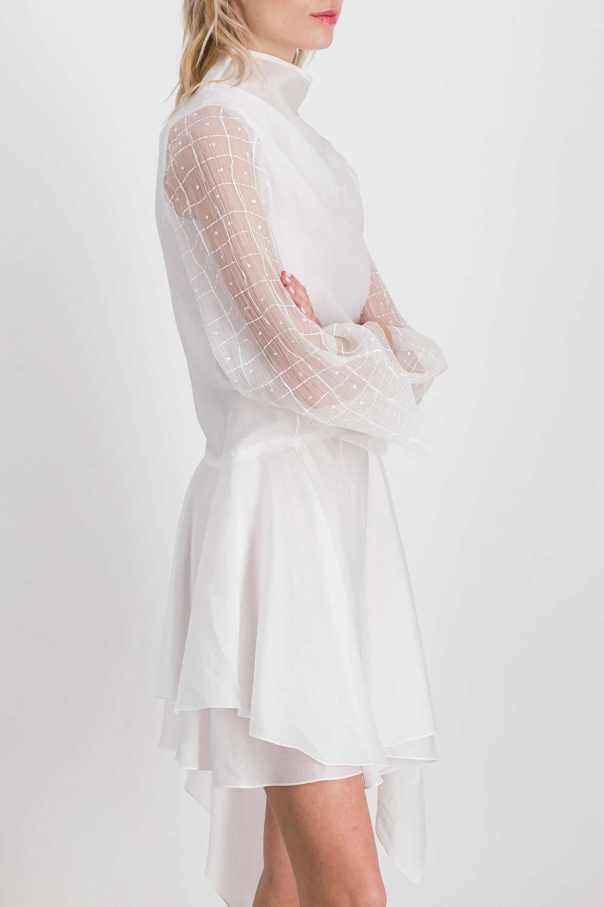 Fluid asymmetric dress with sheer trumpet sleeves